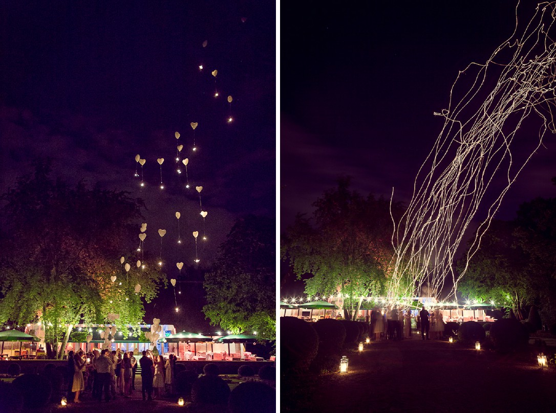 Leuchtende Wunderkerzen an Luftballons in der Nacht